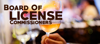 Board of License Commissioners with glass of wine